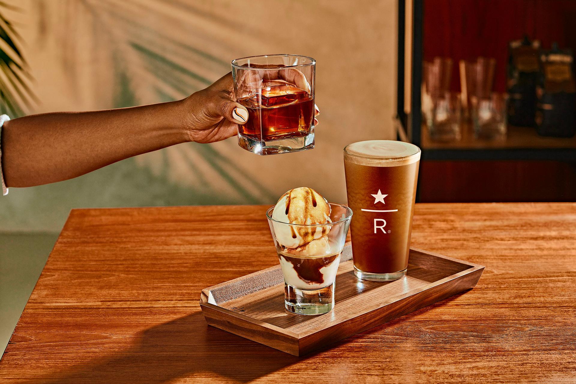 Hand holding coffee at Starbucks Reserve Empire State Building